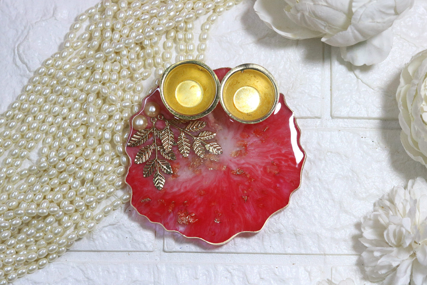 "Elegant Red Resin Pooja Thali with Gold Metal Accents"