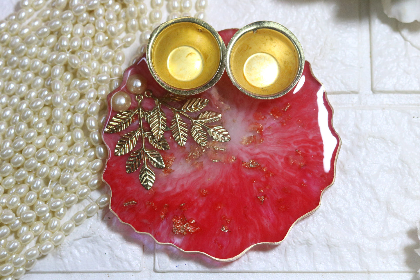 "Elegant Red Resin Pooja Thali with Gold Metal Accents"