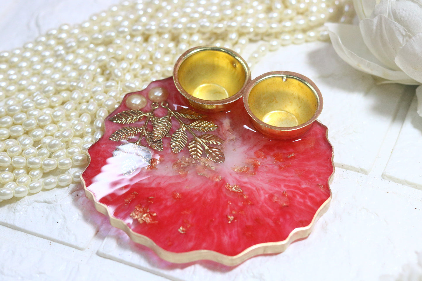 "Elegant Red Resin Pooja Thali with Gold Metal Accents"