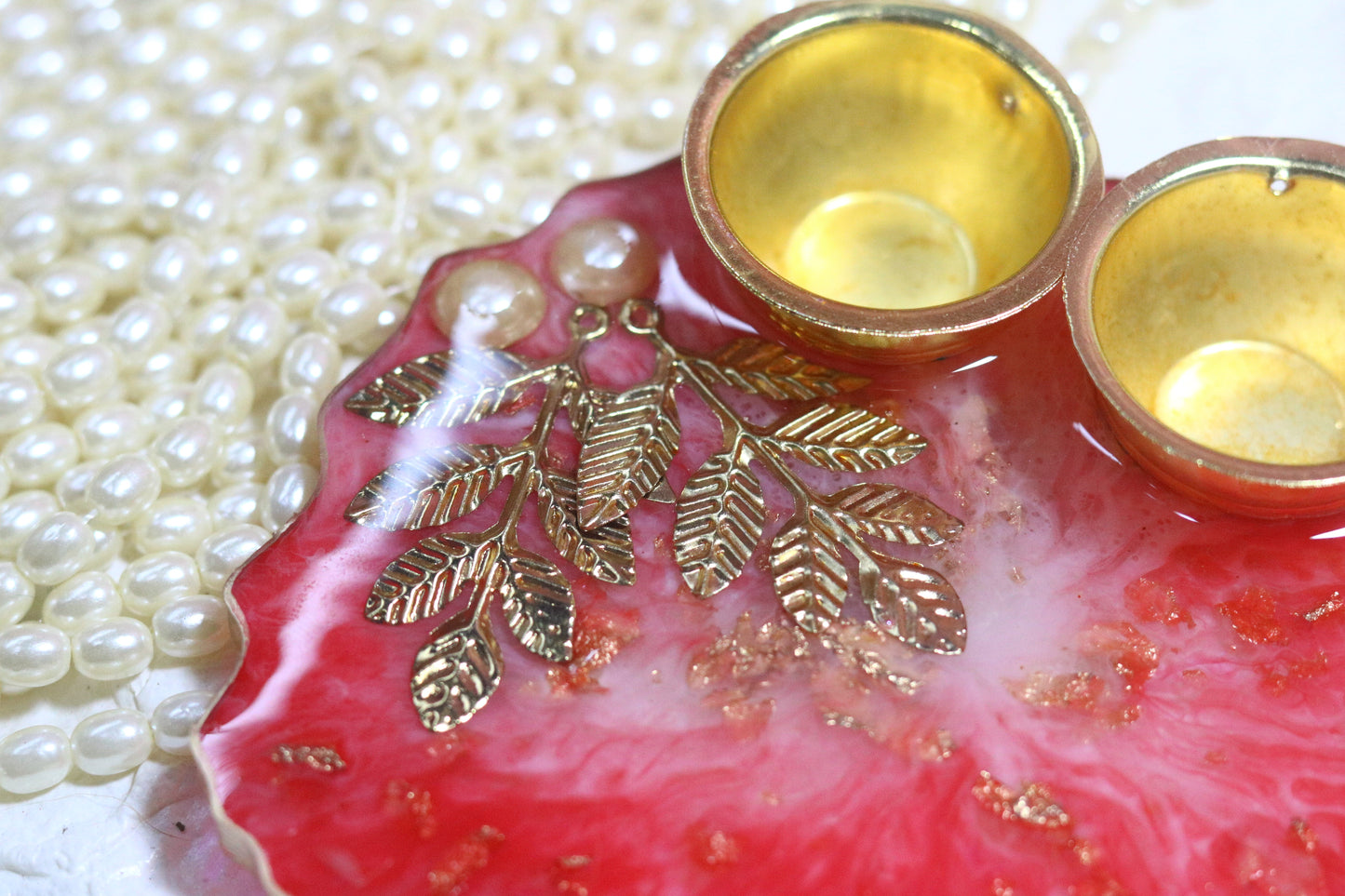 "Elegant Red Resin Pooja Thali with Gold Metal Accents"