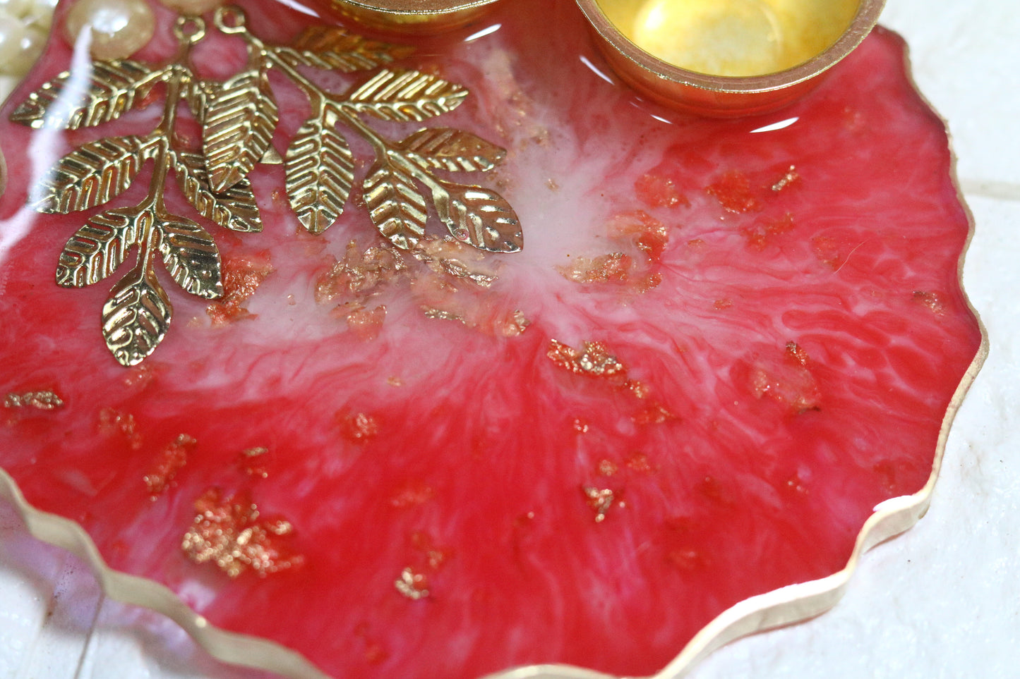 "Elegant Red Resin Pooja Thali with Gold Metal Accents"