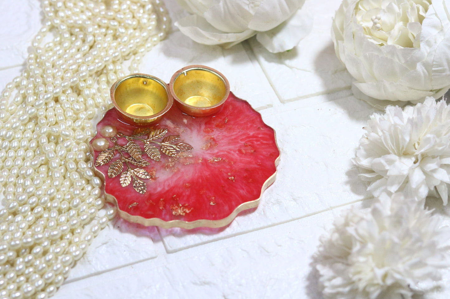 "Elegant Red Resin Pooja Thali with Gold Metal Accents"