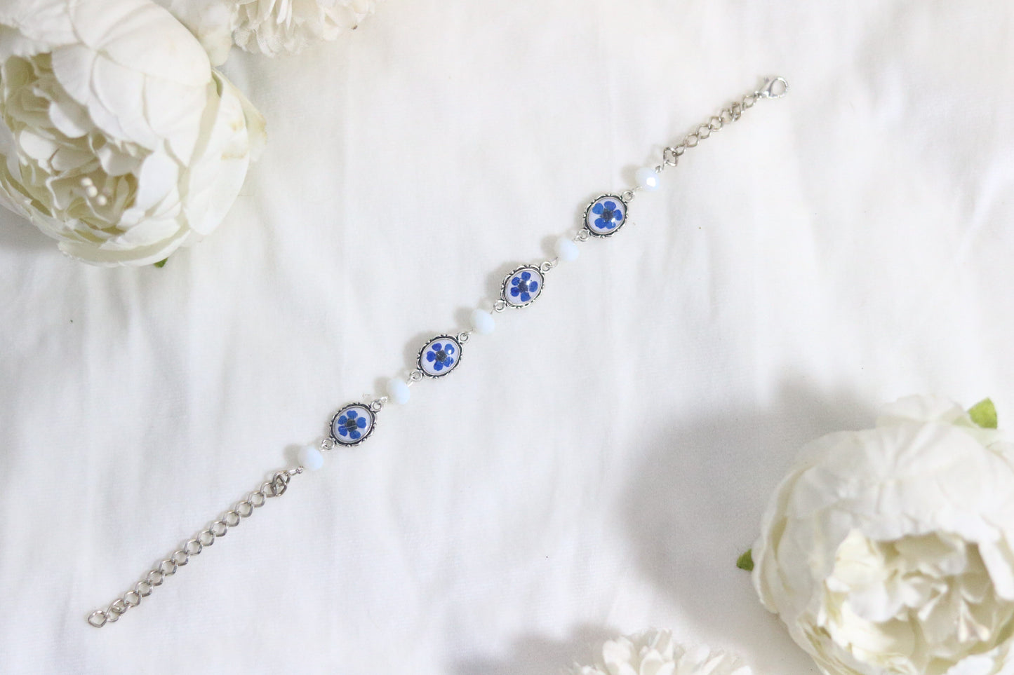 "Elegant Blue Flower Bracelet with Silver Chain & White Glass Beads"