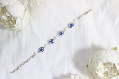 "Elegant Blue Flower Bracelet with Silver Chain & White Glass Beads"