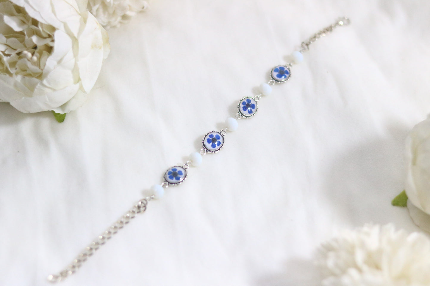 "Elegant Blue Flower Bracelet with Silver Chain & White Glass Beads"